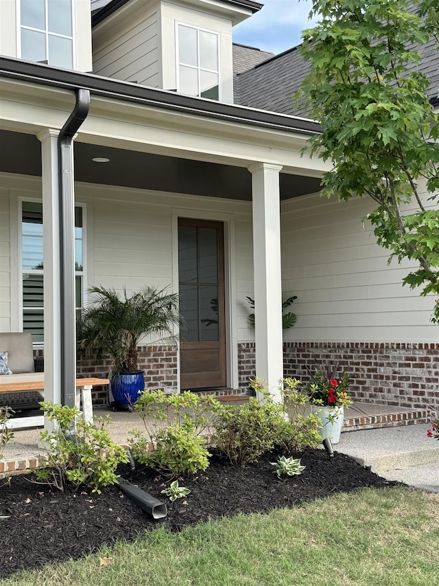 330 Mary Taylor Way, Piperton, TN 38017 - view of exterior entry featuring covered porch, brick siding, and roof with shingles