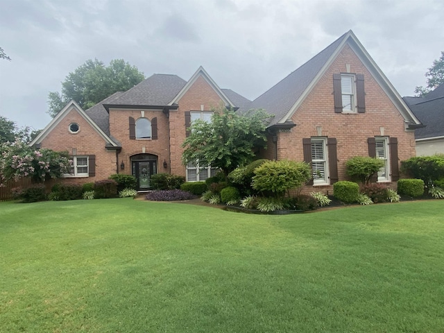 10202 Wynmanor Dr, Collierville, TN 38017 - traditional home featuring brick siding, a front yard, and a shingled roof