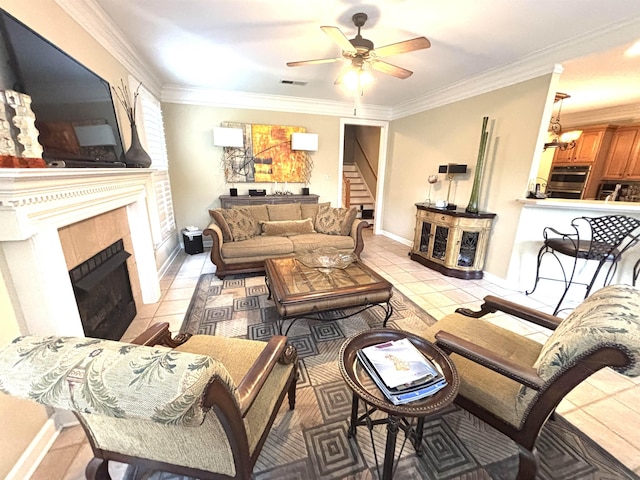 10202 Wynmanor Dr, Collierville, TN 38017 - living room with stairs, a tiled fireplace, ornamental molding, ceiling fan, and light tile patterned flooring