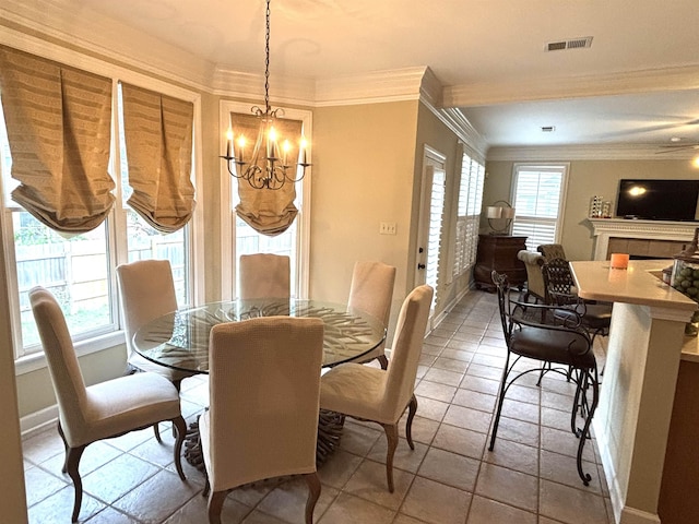 10202 Wynmanor Dr, Collierville, TN 38017 - dining area featuring a chandelier, crown molding, and baseboards