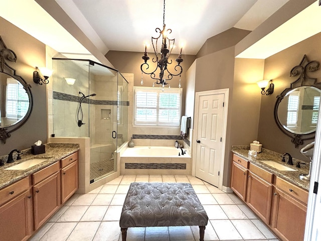 10202 Wynmanor Dr, Collierville, TN 38017 - full bathroom featuring a garden tub, a stall shower, tile patterned flooring, a chandelier, and lofted ceiling