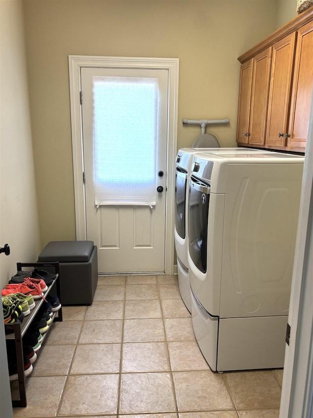 10202 Wynmanor Dr, Collierville, TN 38017 - clothes washing area with cabinet space and washer and clothes dryer