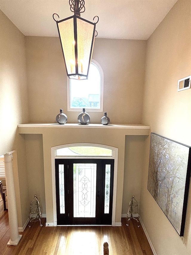 10202 Wynmanor Dr, Collierville, TN 38017 - foyer entrance with wood finished floors, healthy amount of natural light, a chandelier, and baseboards