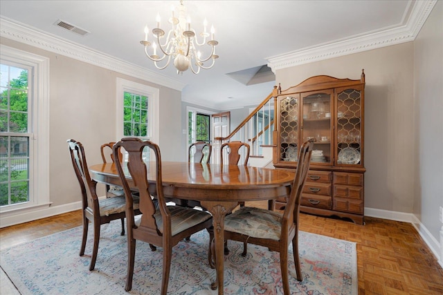 dining area featuring visible vents, ornamental molding, a chandelier, and a healthy amount of sunlight