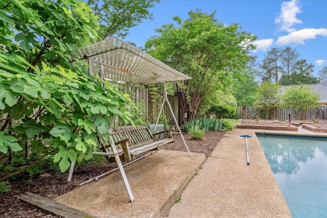 view of swimming pool with a fenced backyard, a fenced in pool, and a pergola