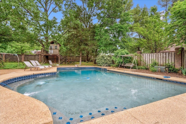 view of swimming pool with a fenced in pool and a fenced backyard