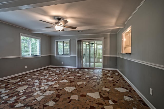 spare room featuring crown molding, a ceiling fan, and baseboards