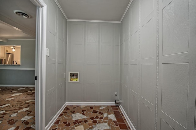 clothes washing area with visible vents, laundry area, ornamental molding, baseboards, and hookup for a washing machine