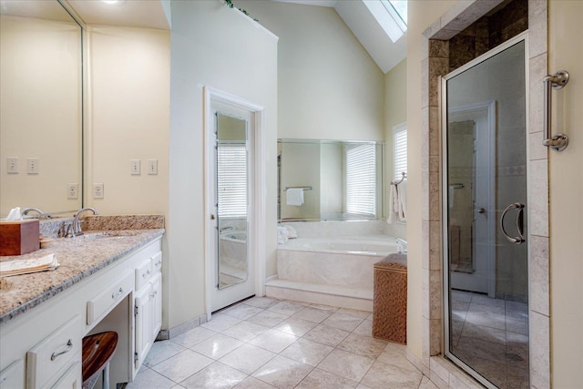 819 N Tree Dr, Collierville, TN 38017 - bathroom with tile patterned flooring, vanity, a shower stall, a skylight, and a bath