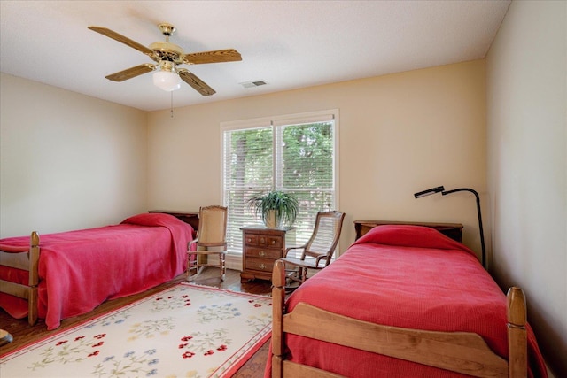819 N Tree Dr, Collierville, TN 38017 - bedroom with ceiling fan, visible vents, and wood finished floors