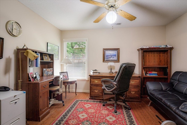 819 N Tree Dr, Collierville, TN 38017 - home office with ceiling fan, visible vents, baseboards, and light wood-style floors