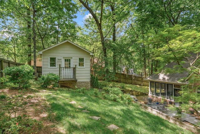 819 N Tree Dr, Collierville, TN 38017 - view of yard featuring a fenced backyard and a sunroom