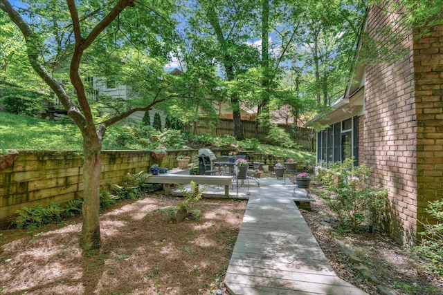 819 N Tree Dr, Collierville, TN 38017 - view of yard featuring a wooden deck and a fenced backyard