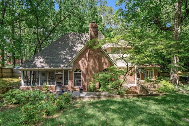 819 N Tree Dr, Collierville, TN 38017 - back of house with fence, a chimney, a sunroom, brick siding, and a patio area