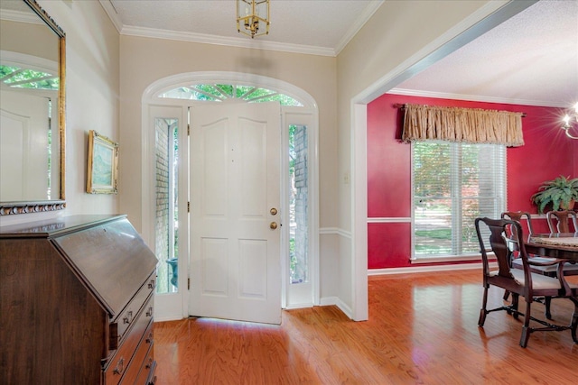 819 N Tree Dr, Collierville, TN 38017 - foyer with ornamental molding, wood finished floors, and a wealth of natural light