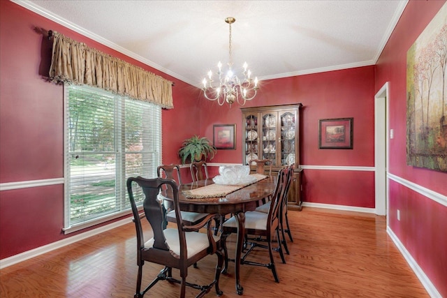819 N Tree Dr, Collierville, TN 38017 - dining room with ornamental molding, a chandelier, and a healthy amount of sunlight