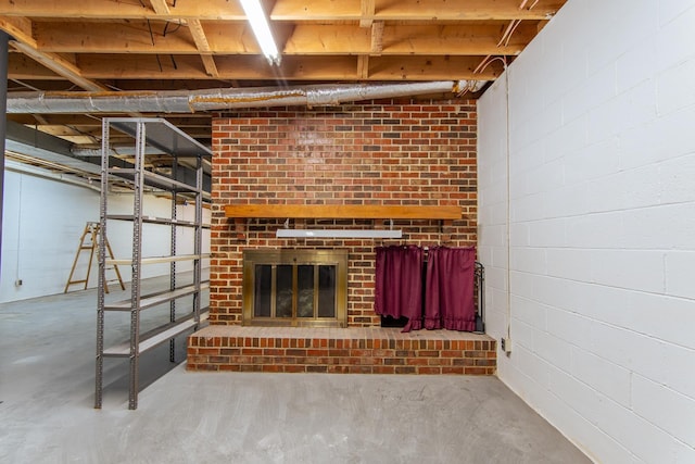 unfurnished living room with concrete floors and a fireplace