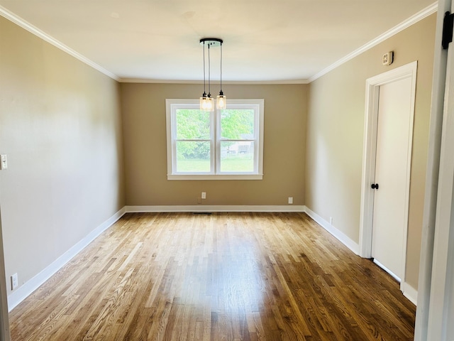 424 Tipton St S, Munford, TN 38058 - unfurnished dining area with baseboards, ornamental molding, and wood finished floors