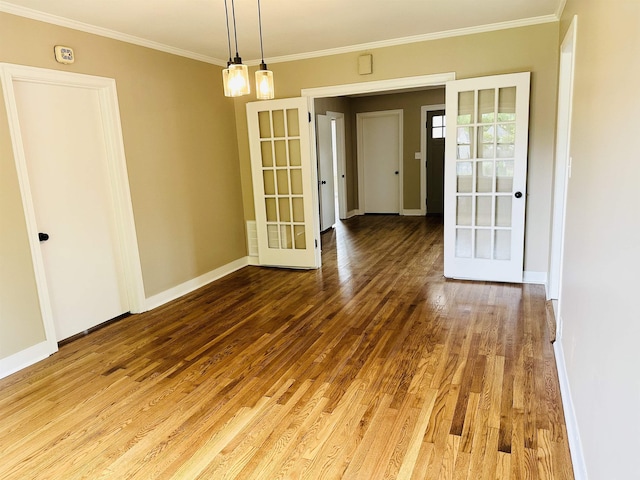 424 Tipton St S, Munford, TN 38058 - unfurnished dining area featuring baseboards, ornamental molding, french doors, and wood finished floors