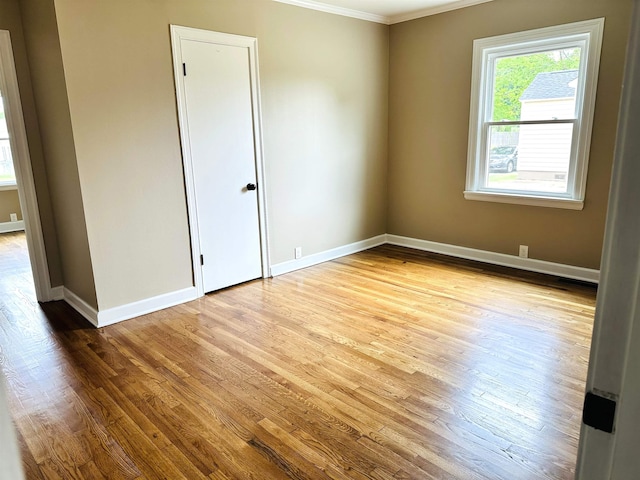 424 Tipton St S, Munford, TN 38058 - empty room with crown molding, baseboards, and wood finished floors