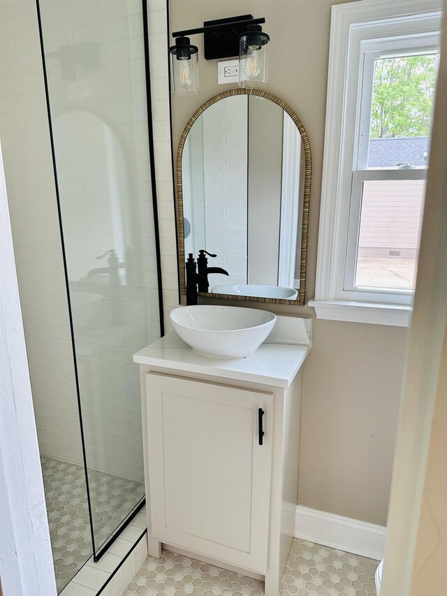 424 Tipton St S, Munford, TN 38058 - bathroom featuring a walk in shower, tile patterned floors, and vanity