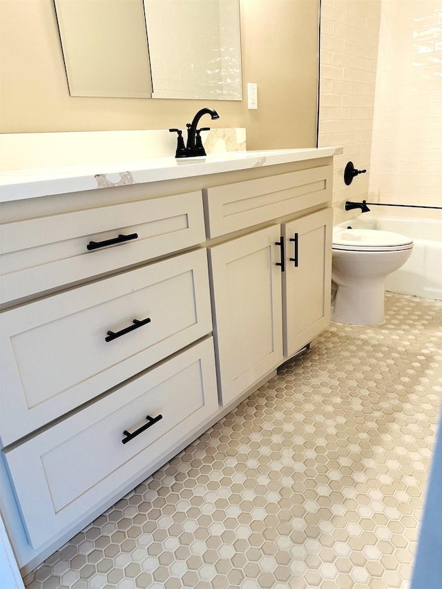 424 Tipton St S, Munford, TN 38058 - bathroom featuring vanity,  shower combination, and toilet