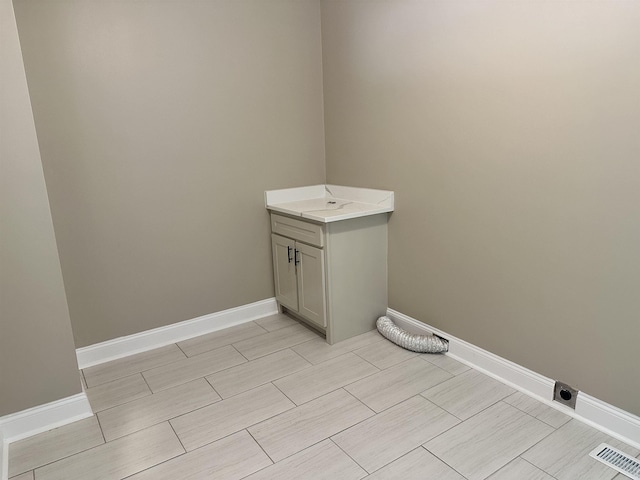 424 Tipton St S, Munford, TN 38058 - bathroom featuring visible vents, wood tiled floor, baseboards, and vanity
