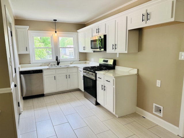 424 Tipton St S, Munford, TN 38058 - kitchen featuring a sink, white cabinets, light stone countertops, and stainless steel appliances