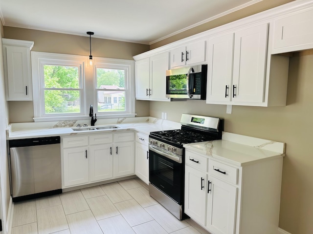 424 Tipton St S, Munford, TN 38058 - kitchen featuring a sink, hanging light fixtures, white cabinets, and stainless steel appliances