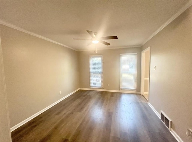 spare room with ceiling fan, a textured ceiling, dark wood finished floors, visible vents, and ornamental molding