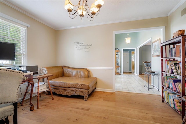 living area featuring crown molding, a notable chandelier, and light wood-style floors