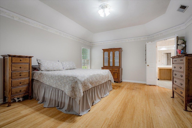 bedroom featuring light wood-style floors, baseboards, and visible vents