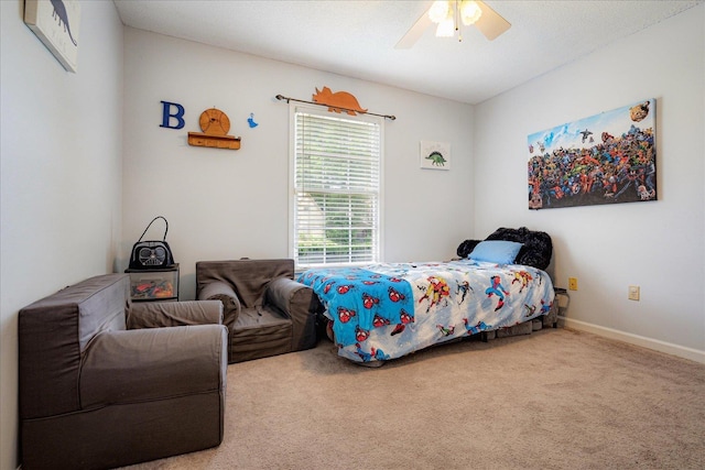 bedroom featuring baseboards, ceiling fan, and carpet