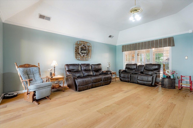 living room featuring high vaulted ceiling, wood finished floors, and visible vents