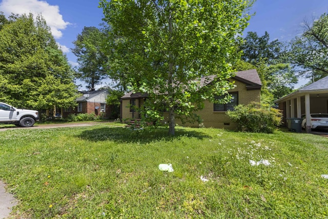 view of front of property featuring brick siding and a front yard