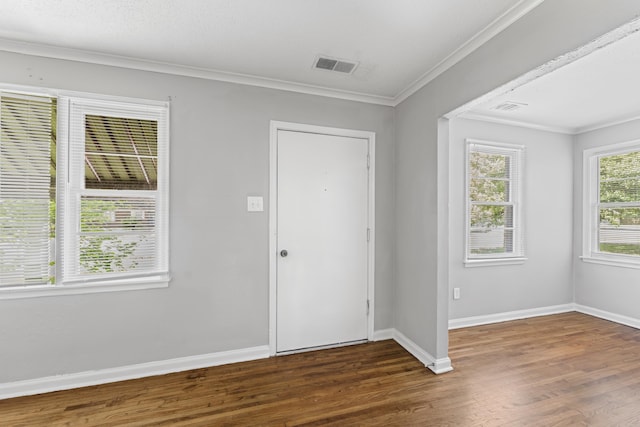 entryway with baseboards, ornamental molding, dark wood-style flooring, and visible vents