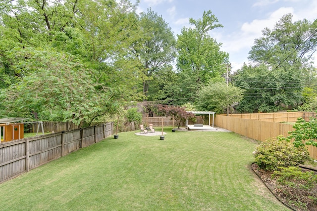 view of yard featuring a patio and a fenced backyard