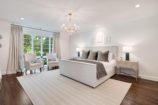bedroom with an inviting chandelier, recessed lighting, and dark wood-type flooring
