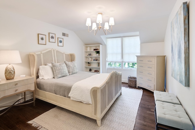 bedroom featuring visible vents, a chandelier, vaulted ceiling, and dark wood-style floors