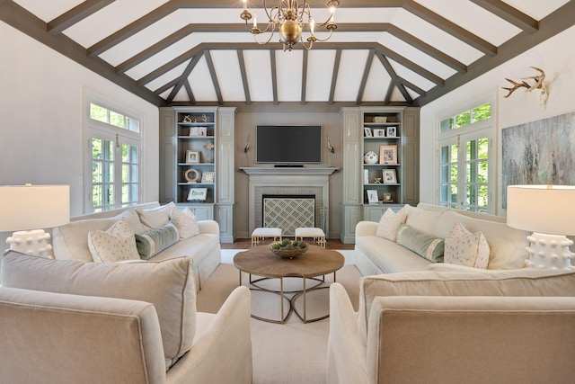 living area with an inviting chandelier, built in shelves, vaulted ceiling with beams, and a fireplace