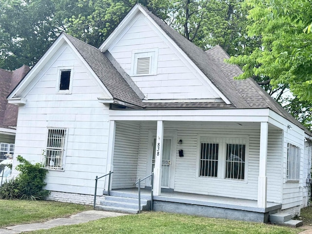 838 Ioka Ave, Memphis, TN 38126 - bungalow-style house with a shingled roof, a front lawn, and covered porch