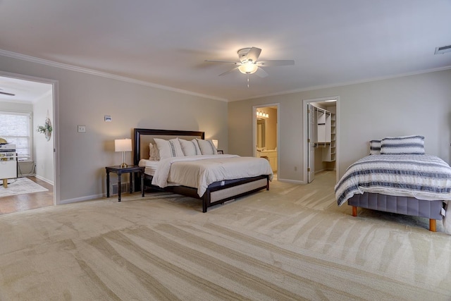 bedroom featuring crown molding, carpet floors, and baseboards
