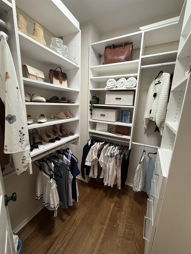 spacious closet with wood finished floors