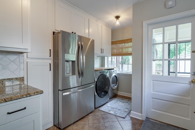 kitchen featuring decorative backsplash, baseboards, washer and clothes dryer, white cabinetry, and stainless steel fridge with ice dispenser