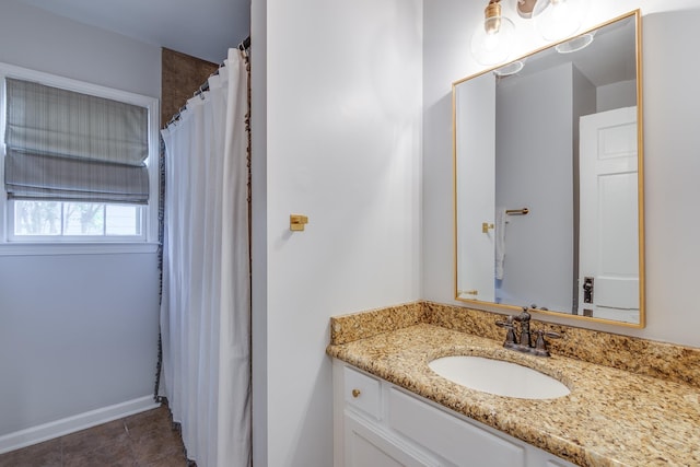 bathroom with vanity, baseboards, tile patterned flooring, and a shower with curtain