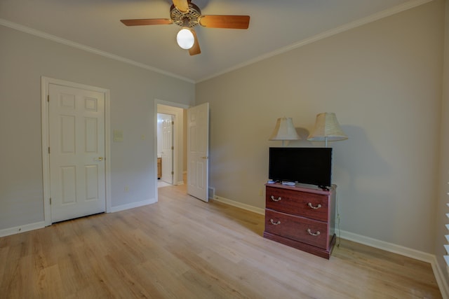 bedroom featuring a ceiling fan, baseboards, ornamental molding, and light wood finished floors