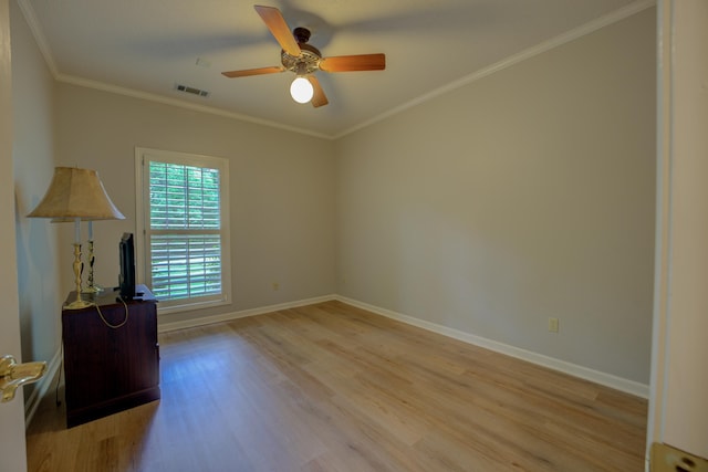 empty room with baseboards, ceiling fan, light wood-type flooring, and visible vents