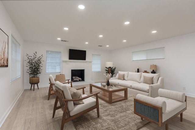 4771 Sea Isle Rd, Memphis, TN 38117 - living room with visible vents, a fireplace, baseboards, recessed lighting, and light wood-style flooring