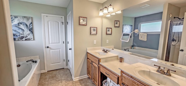 full bath with visible vents, a sink, and a garden tub