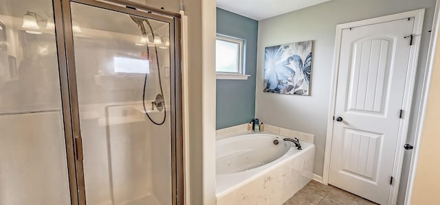 full bath featuring a stall shower, a bath, and tile patterned floors